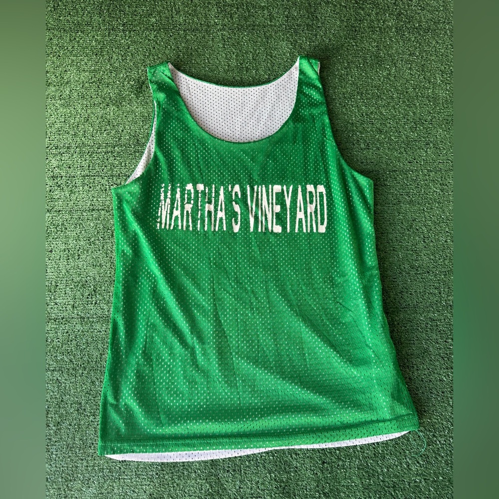 Vintage Green Martha’s Vineyard basketball jersey fits like a medium - large.